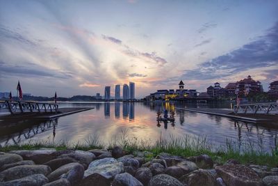 Scenic view of river against sky during sunset