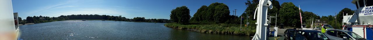 Panoramic view of river amidst trees against sky