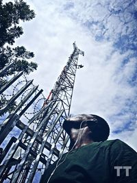 Low angle view of statue at construction site against sky