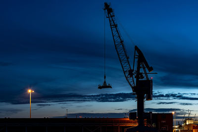 Low angle view of crane at construction site