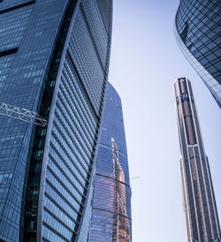 Low angle view of modern buildings against clear sky