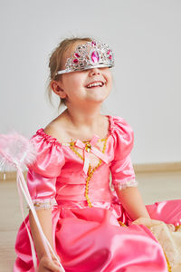 Little girl enjoying her role of princess. adorable cute 5-6 years old girl wearing princess dress