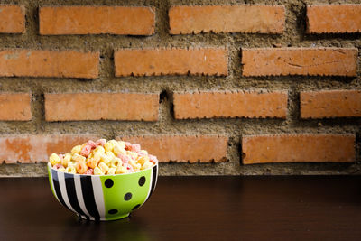 Close-up of food on table against wall