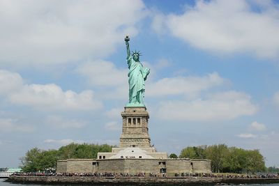 Low angle view of statue against cloudy sky