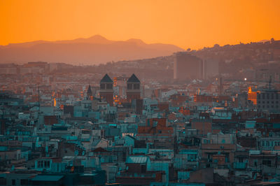 View of buildings in city during sunset