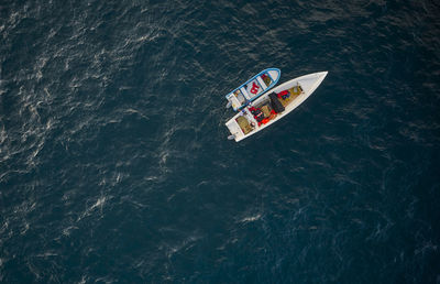 Aerial view of traditional fishing boat in caraballeda with crystal clear turquoise sea, la guaira