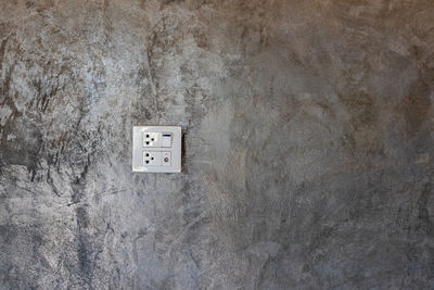 Close-up of light switch on wall