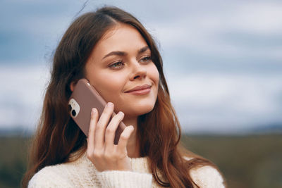 Young woman using mobile phone