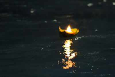 Illuminated burning water at night