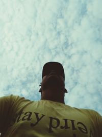 Rear view of man standing against sky