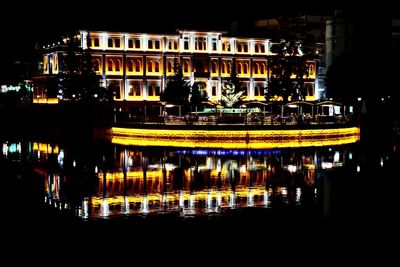 Illuminated buildings in city at night