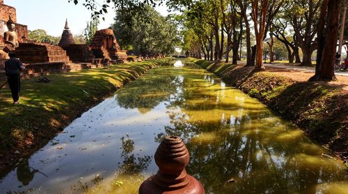 Buddha statue by lake