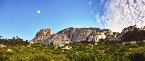 Low angle view of rock formations against sky