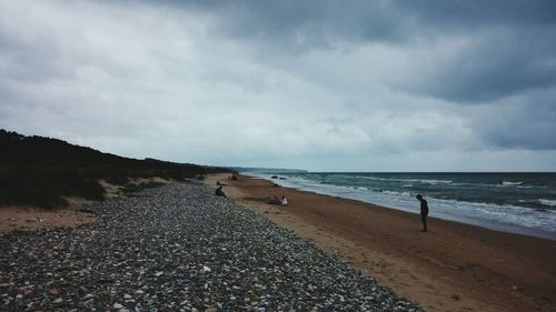 Scenic view of sea against cloudy sky