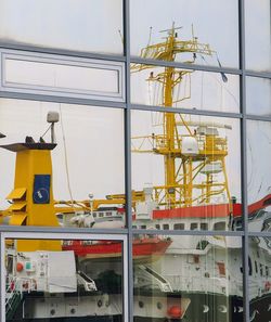 Low angle view of yellow construction site against sky