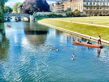 Scenic view of river against buildings