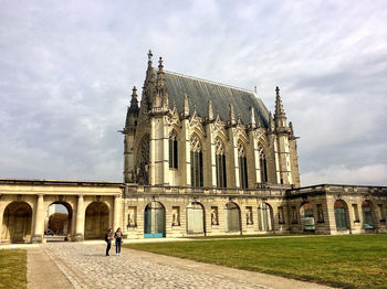 Facade of historic building against sky