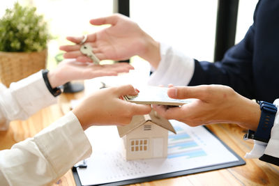 Midsection of doctor examining patient in office