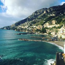 Town on mountains by sea at amalfi coast