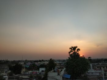 High angle view of townscape against sky at sunset