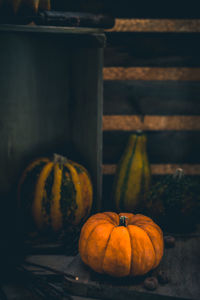 Close-up of pumpkin against stone wall