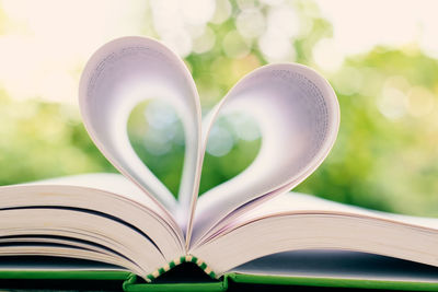 Close-up of heart shape on book