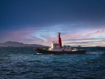 Tug boat is sailing to berth after completed assist vessel to alongside.