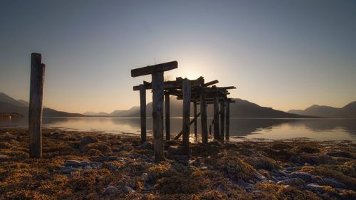 Lifeguard hut on beach against clear sky