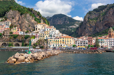 Panoramic view, aerial skyline of small haven of amalfi village with tiny beach and colorful houses 