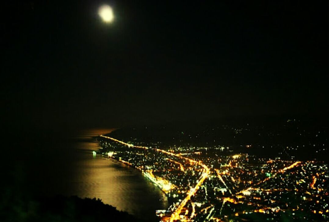 night, illuminated, water, copy space, sea, aerial view, clear sky, scenics, transportation, motion, sky, waterfront, city, moon, long exposure, nature, no people, river, outdoors, beauty in nature