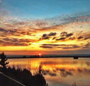 Scenic view of sunset over lake