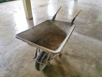 High angle view of rusty metal on wet floor