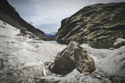 Scenic view of mountain against cloudy sky