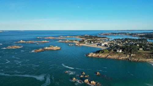 High angle view of sea against blue sky