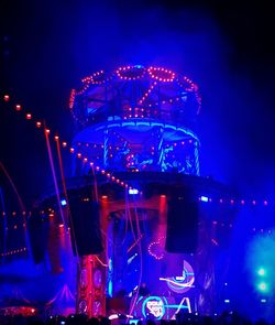 Illuminated ferris wheel at night