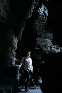 Woman standing on rock