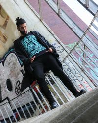 Low angle view of man on staircase