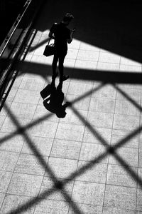 High angle view of man walking on street