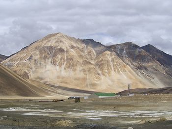 Landscape and mountain range against clouds