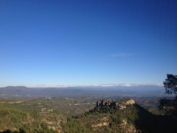 High angle view of landscape against blue sky