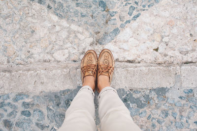 Low section of woman standing on ground