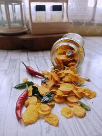 High angle view of fruits in glass jar on table