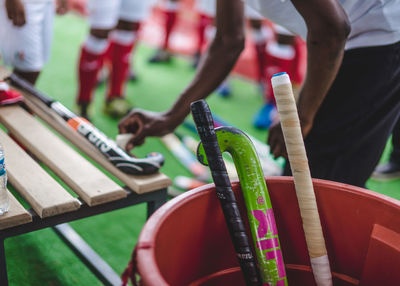 Hockey sticks in bucket