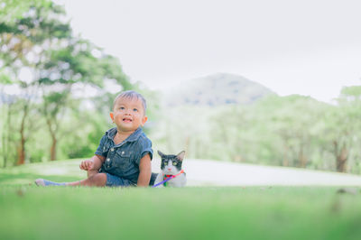 Portrait of cute boy against plants