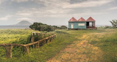 House on field against sky