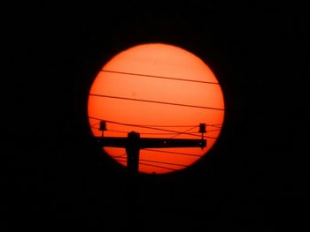 Silhouette of orange against sky during sunset