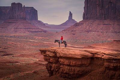 People on rock formations at mountain