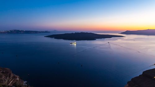 Scenic view of sea against clear sky at sunset