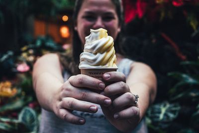 Close-up of hand holding ice cream