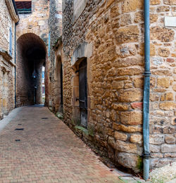 View of alley amidst buildings